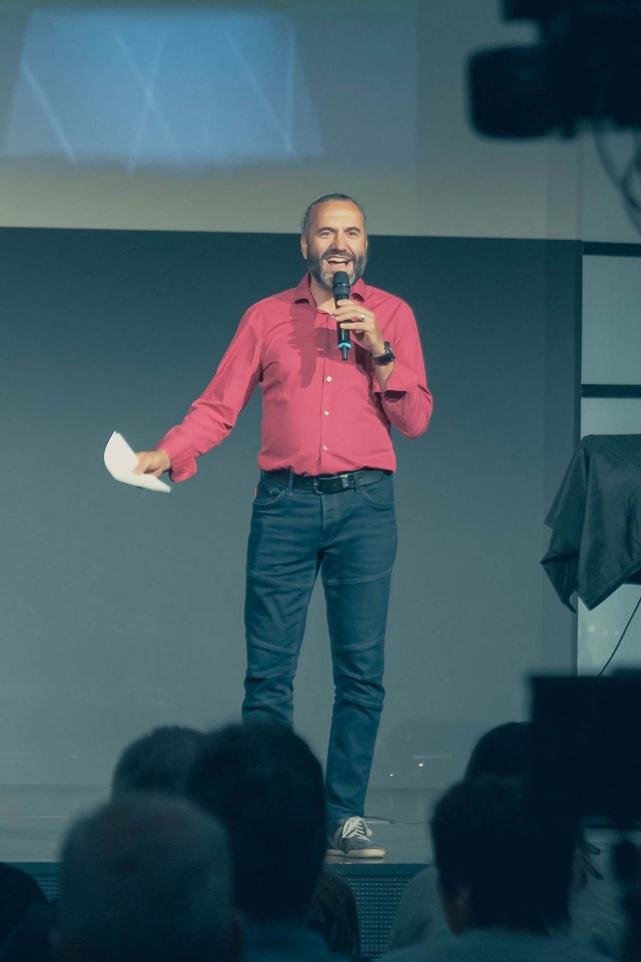 Matthias speaking on stage